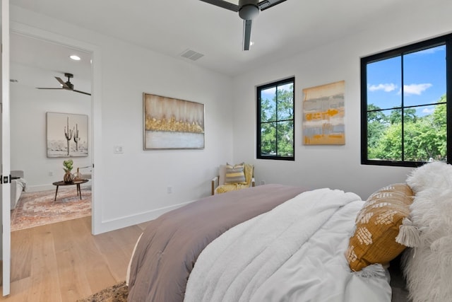 bedroom featuring ceiling fan and light hardwood / wood-style flooring