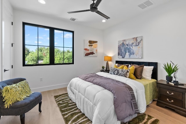 bedroom featuring ceiling fan and light hardwood / wood-style flooring