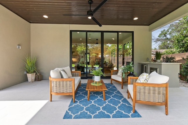 view of patio with ceiling fan and outdoor lounge area