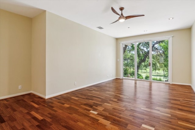 empty room with ceiling fan and hardwood / wood-style floors