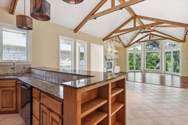 kitchen featuring black dishwasher, beamed ceiling, sink, light tile patterned floors, and decorative backsplash