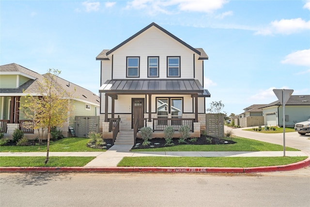 view of front of house with a front lawn and covered porch