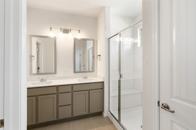 bathroom with an enclosed shower, tile patterned floors, and vanity