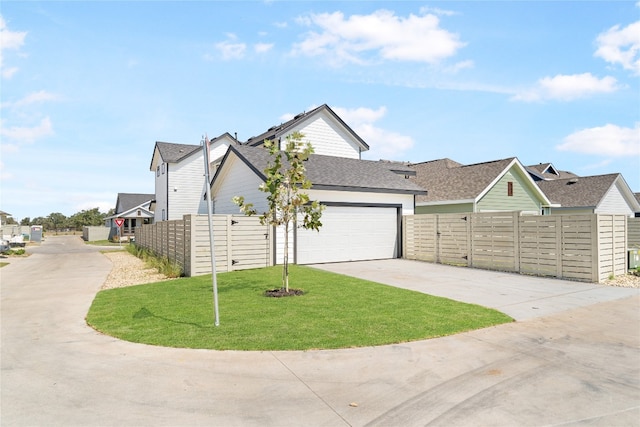 view of front facade with a garage and a front lawn