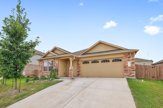 ranch-style home with a garage and a front lawn