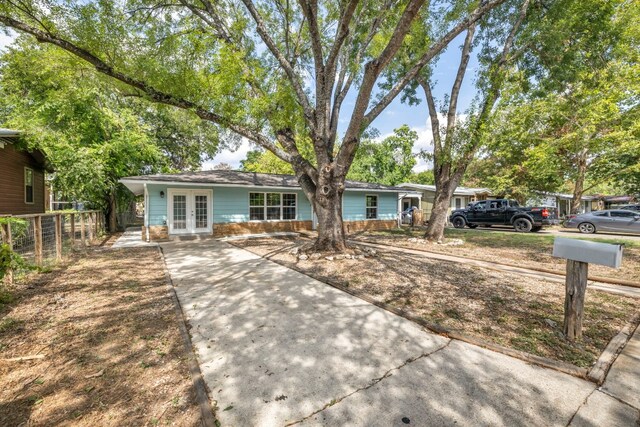 single story home featuring french doors