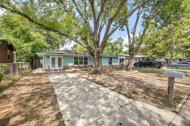 single story home featuring french doors