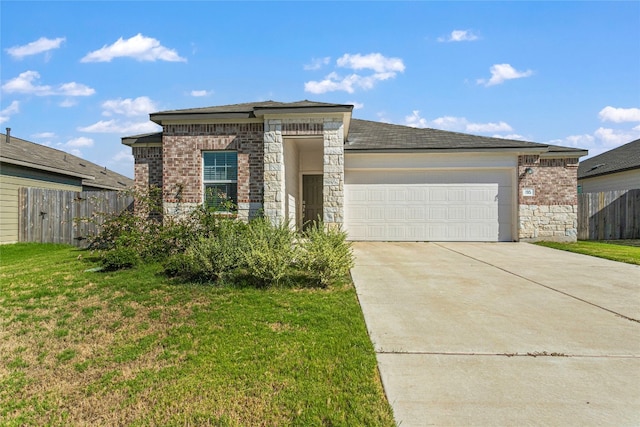 view of front facade with a front yard and a garage