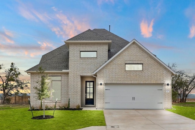 view of front of home with a yard