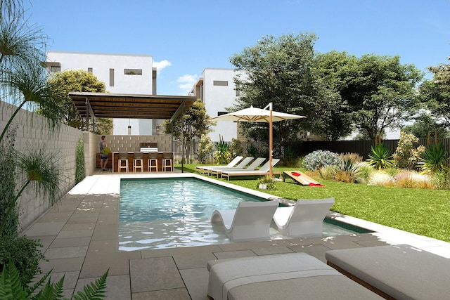 view of pool with a patio, a lawn, and an outdoor bar