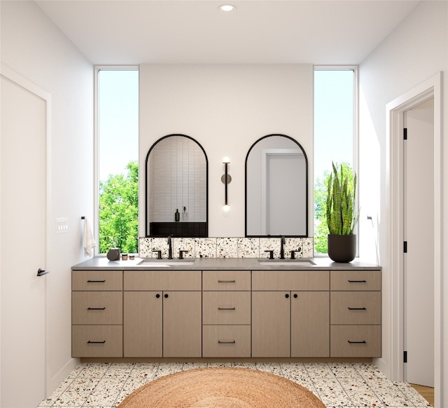 bathroom with vanity and a wealth of natural light