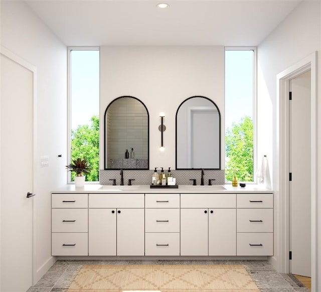 bathroom with a healthy amount of sunlight and vanity