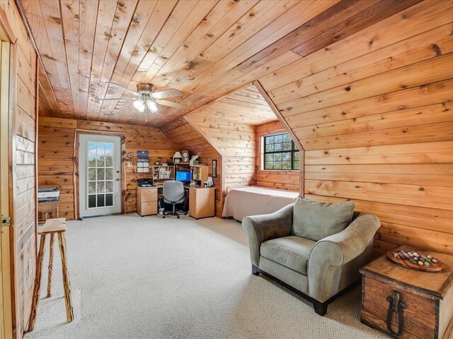 interior space featuring carpet floors, ceiling fan, vaulted ceiling, and wood ceiling