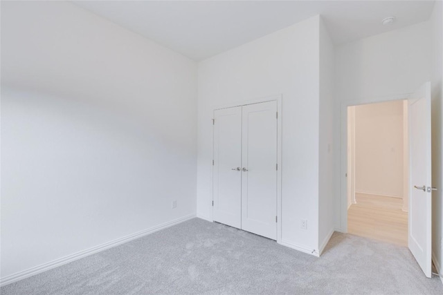 247 Du Bois Ln, Kyle, TX 78640 - unfurnished bedroom with a closet, baseboards, and carpet