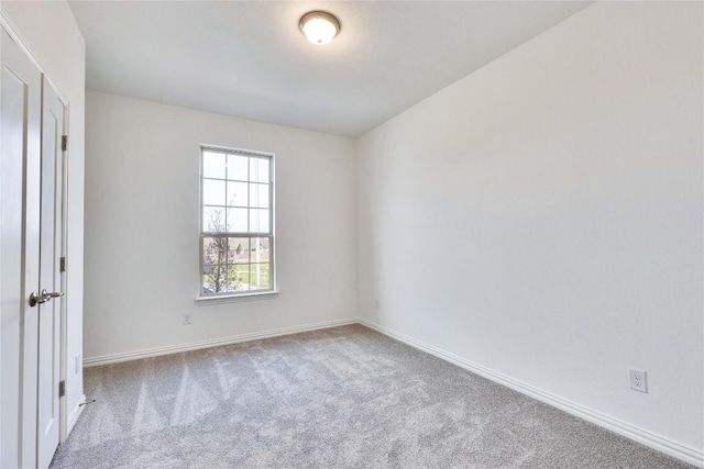 247 Du Bois Ln, Kyle, TX 78640 - empty room with carpet flooring and baseboards