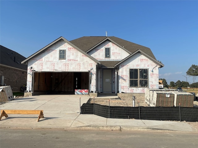 property in mid-construction with a garage