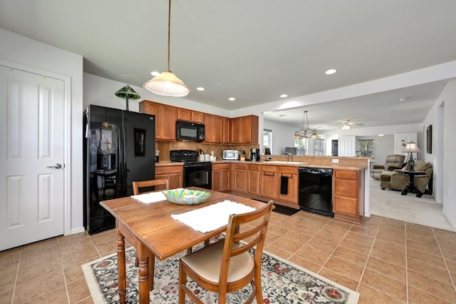 carpeted dining room with sink and ceiling fan