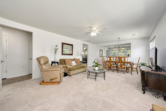 carpeted living room featuring ceiling fan