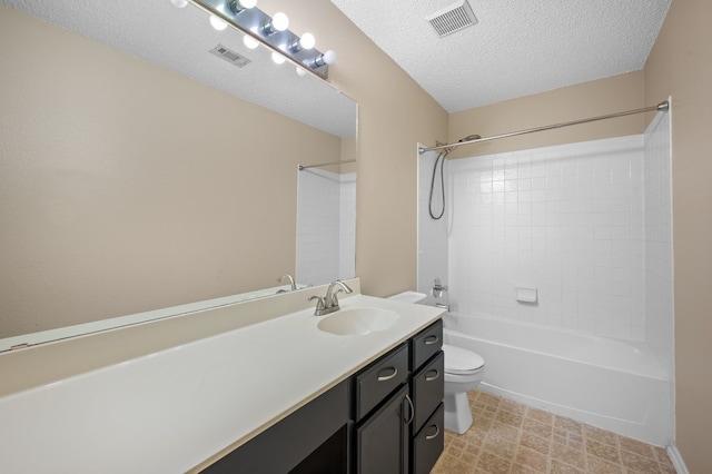 full bathroom featuring vanity, toilet, a textured ceiling, and shower / bathtub combination