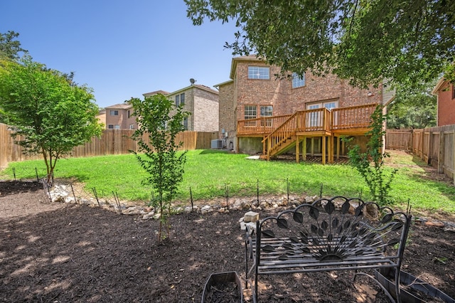 view of yard featuring a wooden deck and central air condition unit