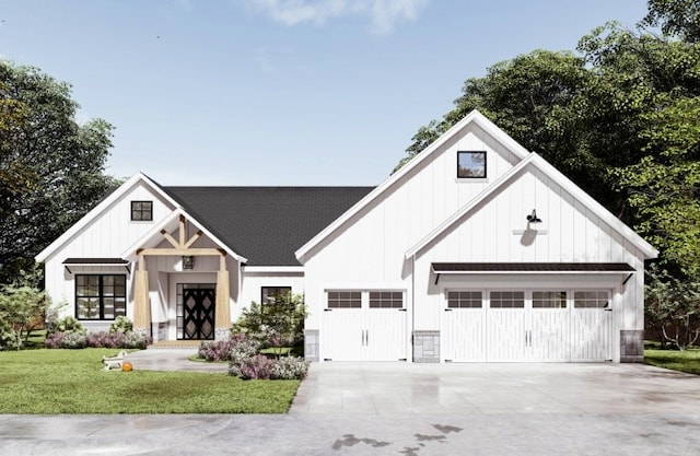 view of front of house with a garage and a front lawn