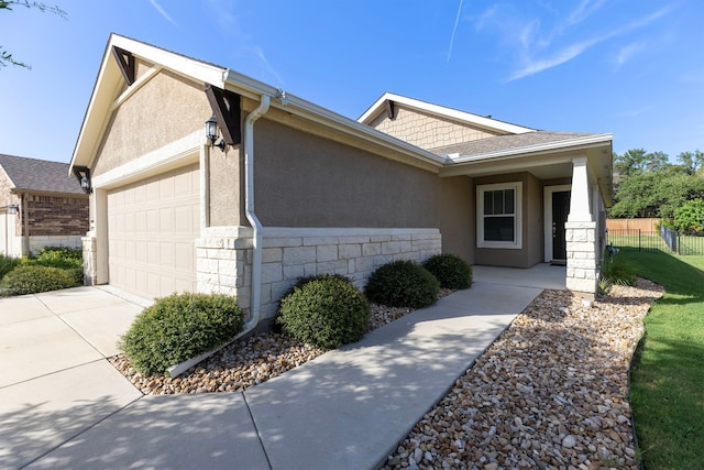 view of property exterior featuring a garage