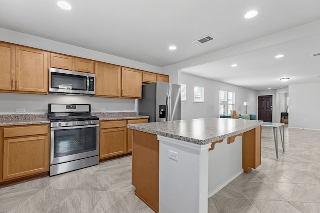 kitchen featuring appliances with stainless steel finishes and a center island