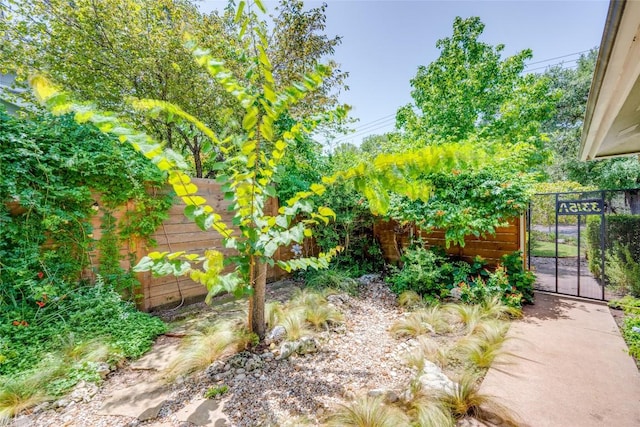 view of yard with a gate and fence