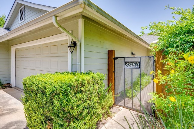 3315 W William Cannon Dr Unit A, Austin, TX 78745 - view of property exterior with a gate and concrete driveway