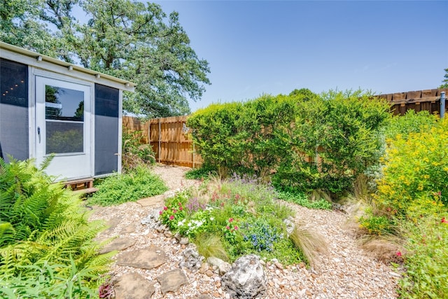 view of yard with a storage unit