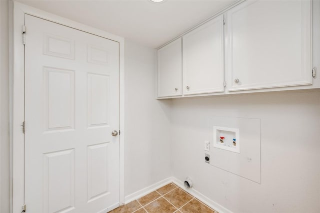 laundry area with cabinet space, light tile patterned floors, baseboards, hookup for a washing machine, and electric dryer hookup