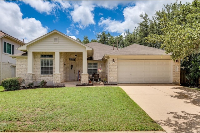 view of front of home with a garage and a front yard