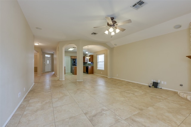 unfurnished living room with light tile patterned flooring, ceiling fan, and lofted ceiling