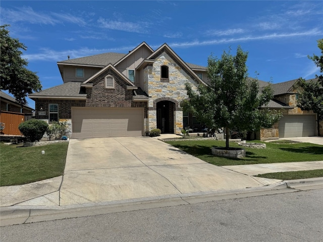 view of front facade with a garage and a front yard