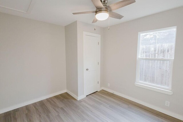 empty room featuring light hardwood / wood-style floors and ceiling fan