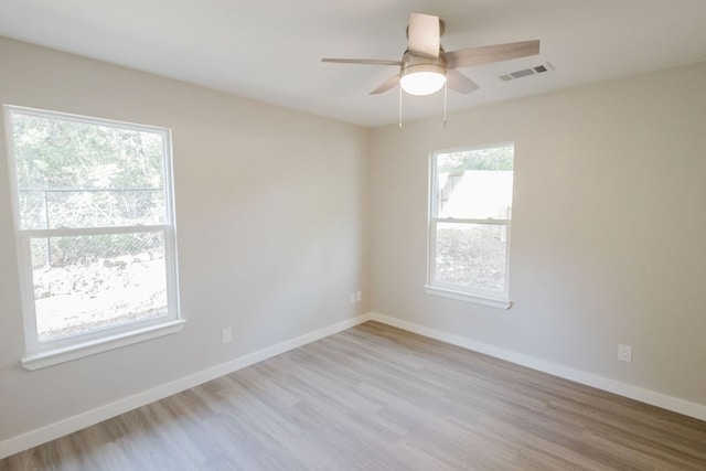 unfurnished room featuring ceiling fan and light hardwood / wood-style flooring