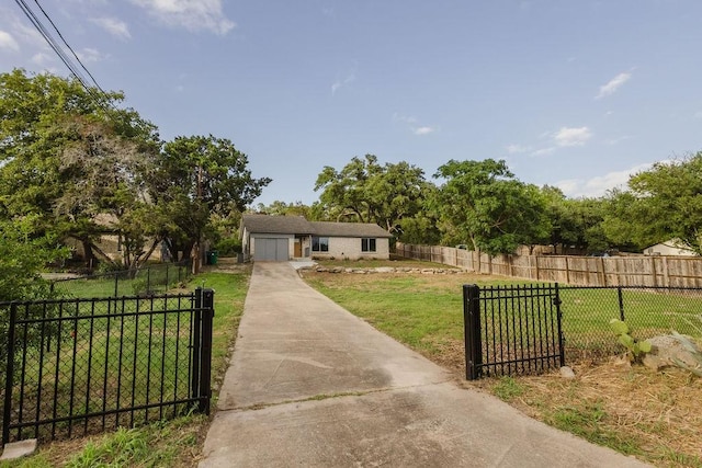 view of front of house featuring a garage and a front lawn