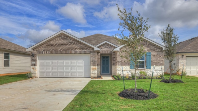 single story home featuring a front yard and a garage