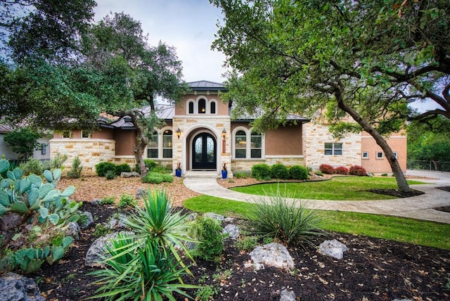 7610 Ramble Rdg, San Antonio, TX 78266 - mediterranean / spanish house with stone siding, stucco siding, and french doors