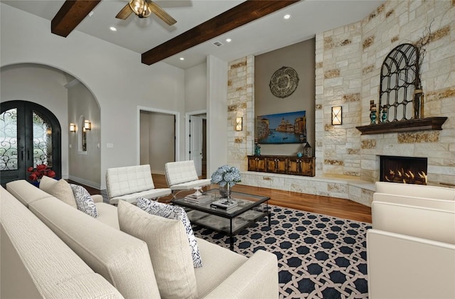 7610 Ramble Rdg, San Antonio, TX 78266 - living room featuring arched walkways, ceiling fan, wood finished floors, beam ceiling, and recessed lighting