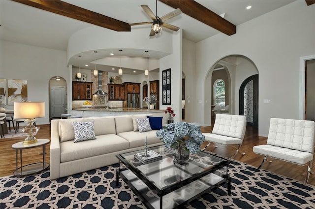 7610 Ramble Rdg, San Antonio, TX 78266 - living room with arched walkways, wood finished floors, a ceiling fan, recessed lighting, and high vaulted ceiling