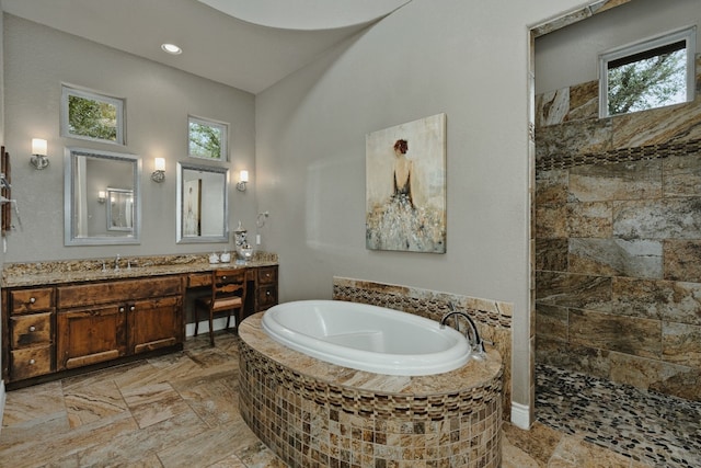 bathroom with tile patterned floors, plenty of natural light, vanity, and shower with separate bathtub