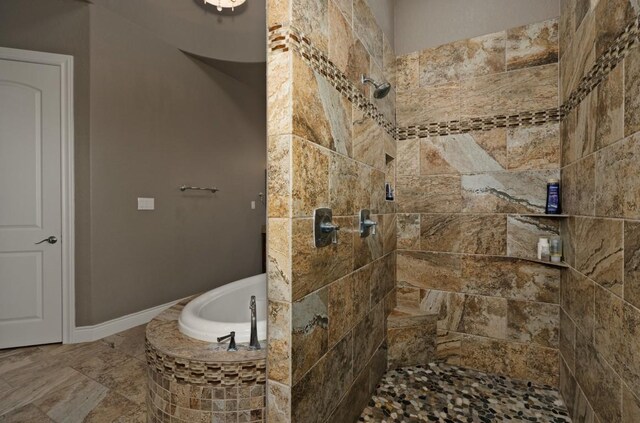 bathroom featuring plus walk in shower and tile patterned flooring