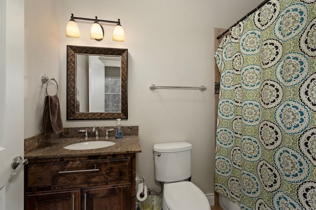 bathroom with toilet and vanity