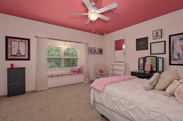 carpeted bedroom with ceiling fan and crown molding