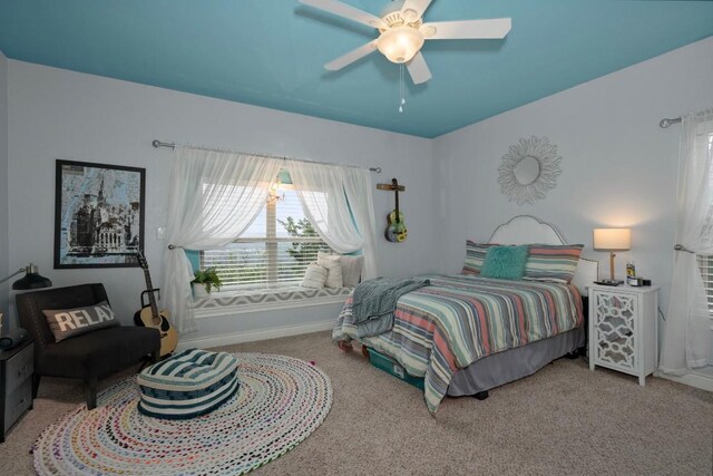 carpeted bedroom featuring ceiling fan