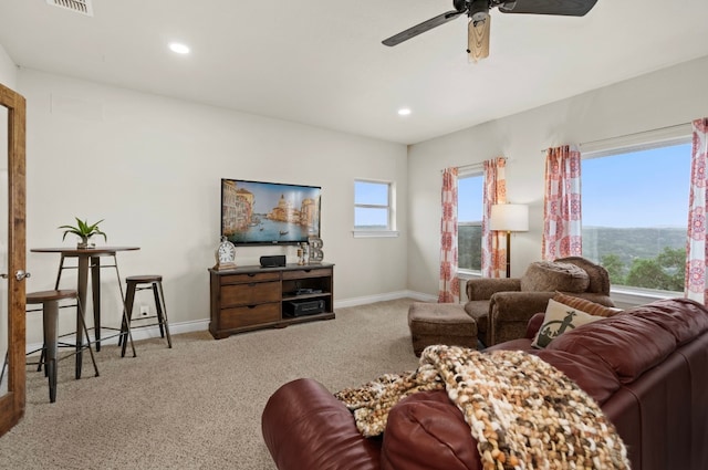 living room with carpet floors and ceiling fan