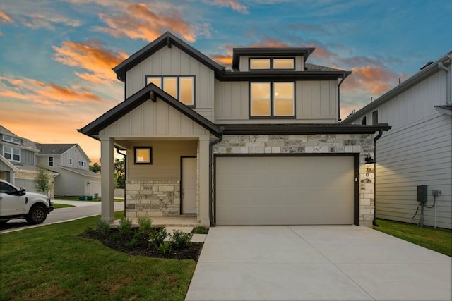 320 Creek Rd Unit 206, Dripping Springs, TX 78620 - craftsman-style house featuring stone siding, a garage, board and batten siding, concrete driveway, and a lawn