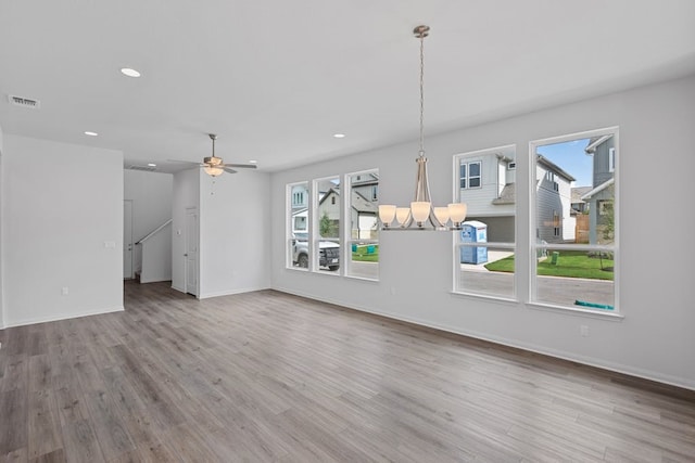320 Creek Rd Unit 206, Dripping Springs, TX 78620 - unfurnished living room featuring healthy amount of natural light, wood finished floors, baseboards, and recessed lighting