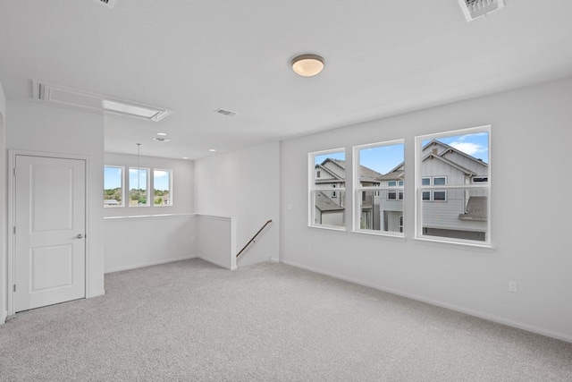 320 Creek Rd Unit 206, Dripping Springs, TX 78620 - carpeted spare room featuring visible vents, attic access, and baseboards